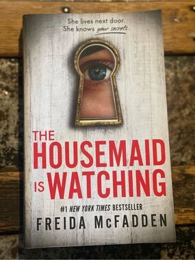 The Housemaid Is Watching by - Thriller Paperback, White and Red